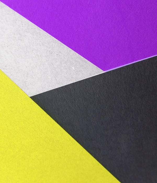 Vibrant geometric composition with yellow, purple, black, and white paper textures.